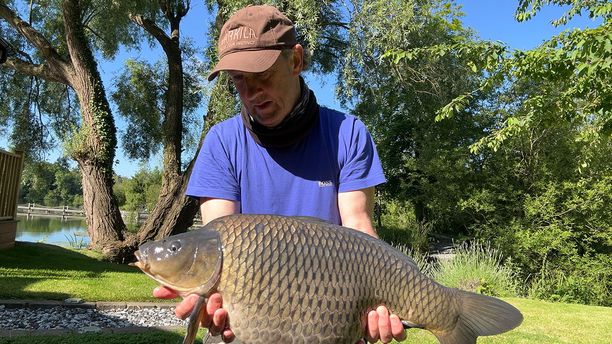 A special Common fish caught by a fisherman on a sunny day.