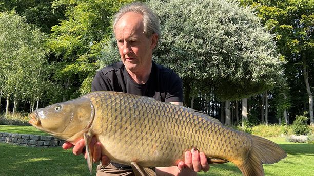 A Common fish caught by a fisherman on a sunny day.