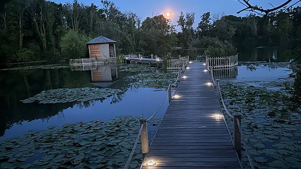 A view of the walkways around the lake at dusk